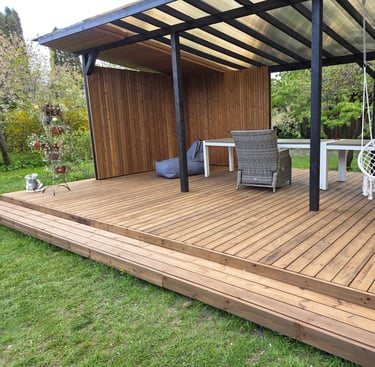a man standing on a deck with a backpack