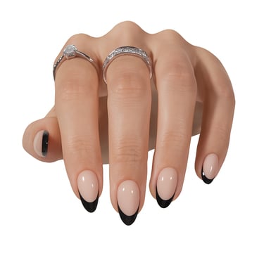 a women's hand with short black tip press on nails