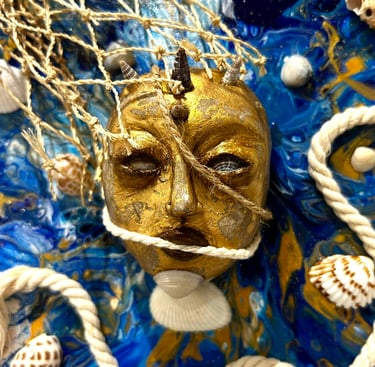 a gold mask with a gold face