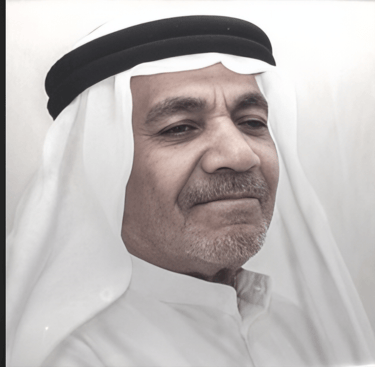 a man in a white shirt and a black and white photo