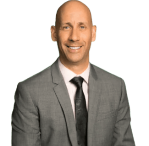 a man in a suit and tie smiling