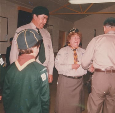cub and scouts leaders in a hut