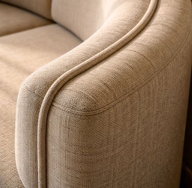 Close-up detail of a custom made banquette showing curved radius, stitching, and upholstery texture