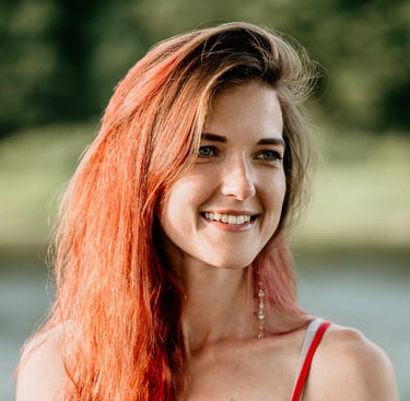 a woman with red hair and a red dress