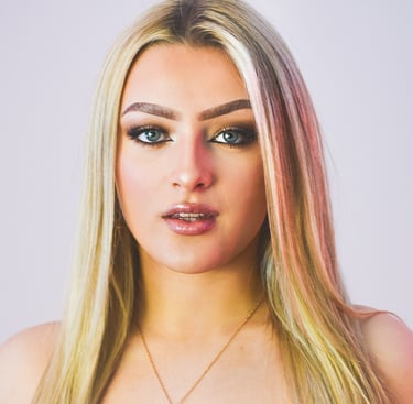 a woman with blonde hair and a green dress