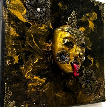 a painting of a gold mask on a white background