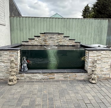 Raised koi ponds build with block paving for garden ponds