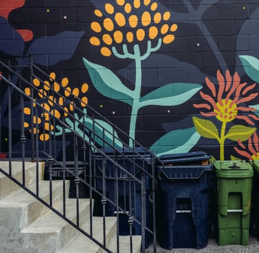 a mural of flowers on the wall of the street 