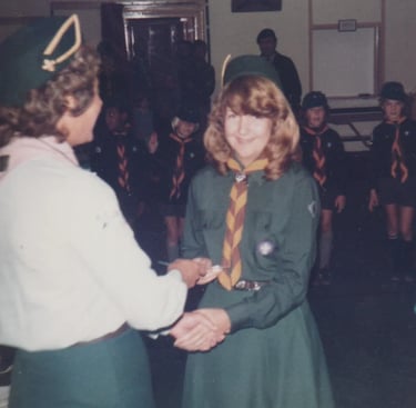 cub and scouts leaders in a hut