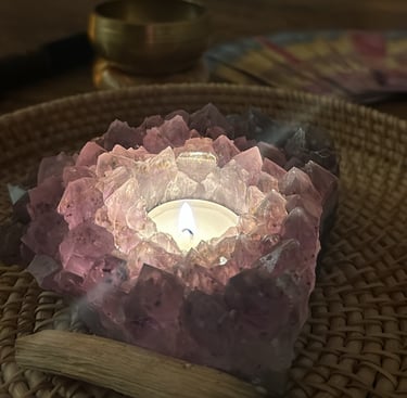 a candle with a candlelight on a table