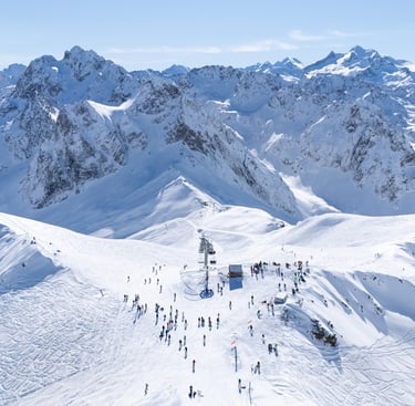 a group of people skiing down a mountain
