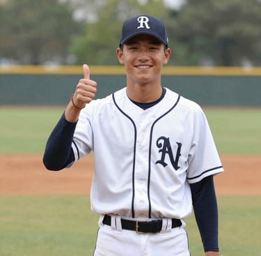 A welcoming hand extended in front of a community center at sunset.