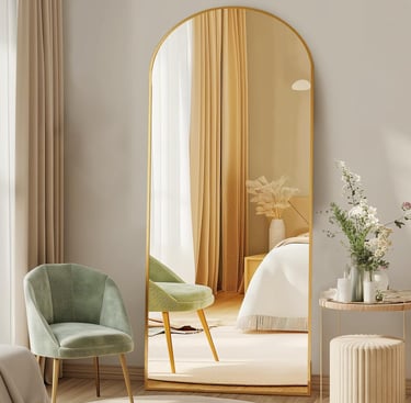 DUMOS arched floor mirror with gold frame styled in a modern bedroom interior