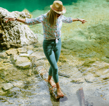 a women learning how to find balance in life and break free from people pleasing, as she is walking