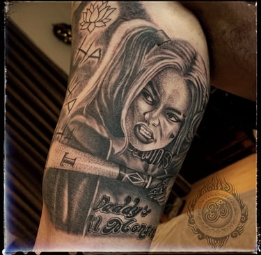 Realistic tattoo of Harley Quinn on the bicep