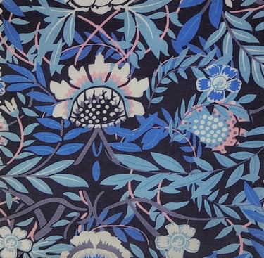 a close up of a fabroc of floral pattern on a black background