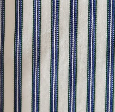 a close up of a striped shirt with a blue and white striped shirt