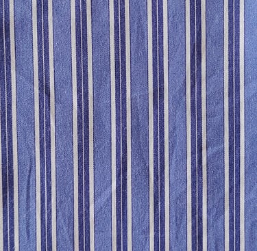 a blue and white striped shirt with a tie