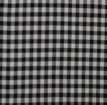 a black and white checkered plaid fabric with a black and white checkered