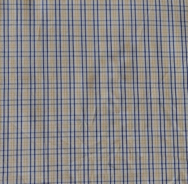 a close up of a shirt with a blue and yellow checkered pattern