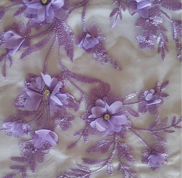 a close up of a purple and white floraled fabric