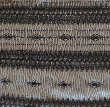 a black lace with a black  lace trimming