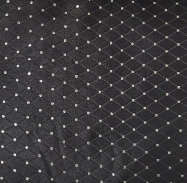 jacquard fabric with white polka dots in a black diamond  check