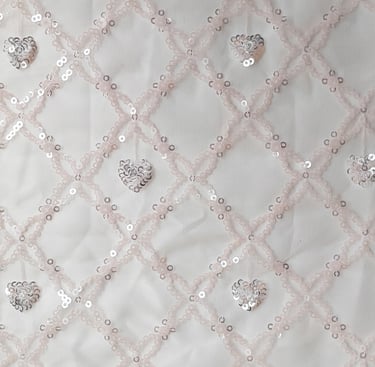 a white fabric with   sequinous