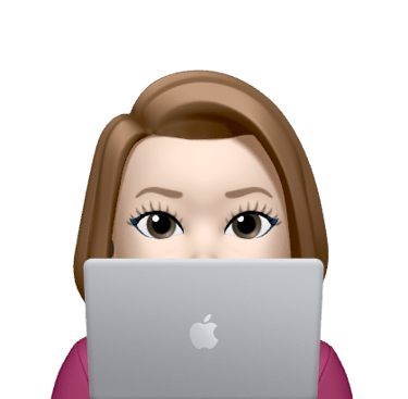a woman with a laptop computer sitting in front of a laptop