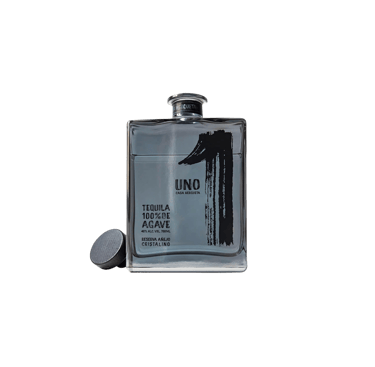 a bottle of uno Tequila Cristalino - premium tequila cristalino