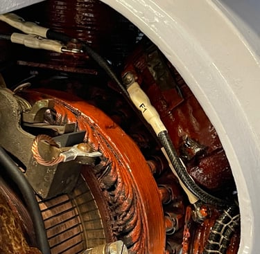 Close up of shunt wound DC motor brush assembly