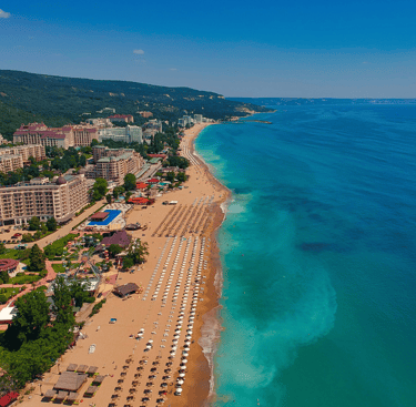 a beach with a view of a beach and a blue sky