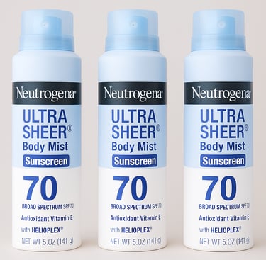 Three bottles of Neutrogena Ultra Sheer Body Mist sunscreen SPF 70 on a neutral background
