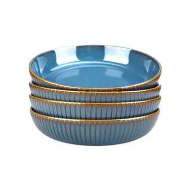  blue ceramic pasta bowls with a ribbed textured exterior and brown rim.