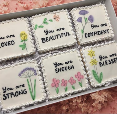 Gift box with beautifully decorated cookies with royal icing and uplifting messages like You are beautiful, strong, blessed