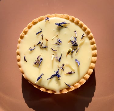 a pie with flowers on a plate