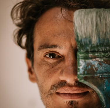 a man with a brush and a paintbrush in his hand