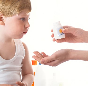child taking medicine  for constipation