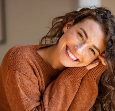 woman posing with a big smile on her face