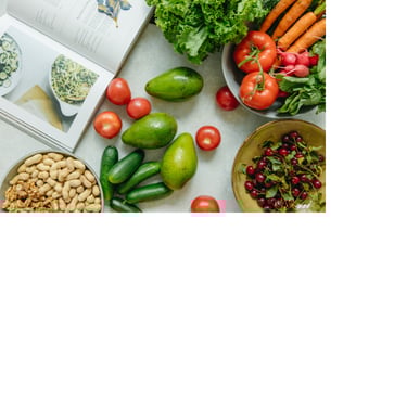Photo of an open cookbook next to colorful ingredients