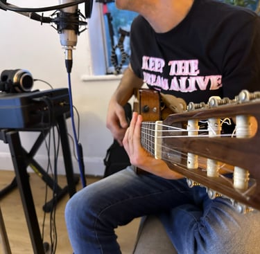 George Papakyriacou in the studio recording acoustic guitar