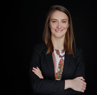 a woman in a suit and a black jacket