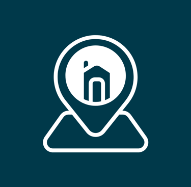a map pin pinpointe with a house in the middle