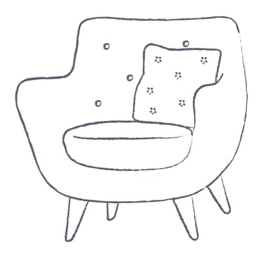 a curved chair with a pillow on it