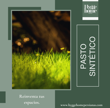 a green grass field with a tree in the background