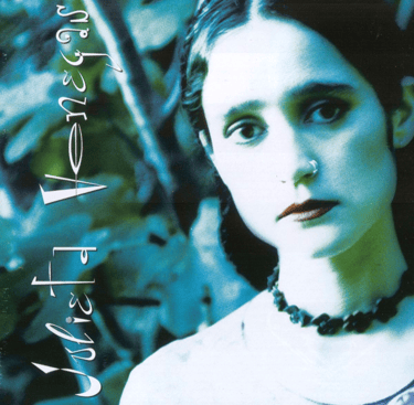 Portada del disco Aquí.