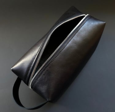 Black travel toiletry bag with handle