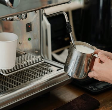 milk stainless steel pitcher while using milk frother