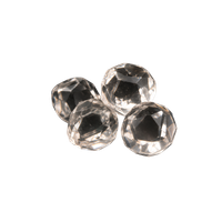Four sparkling rose cut diamonds on a solid black background, showcasing clear gemstone facets.