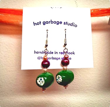 Gold hook dangle earrings with polymer clay blue cheese-stuffed olives and purple pearl beads